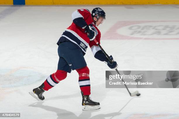 Matthew Gelinas of the Tri-City Americans takes a shot during warm up against the Kelowna Rockets on March 8, 2014 at Prospera Place in Kelowna,...