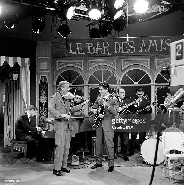 Sacha Distel in the guitar, Stephane Grappelli in the violin, accompanied with an orchestra on the set of ""Everything goes very well""