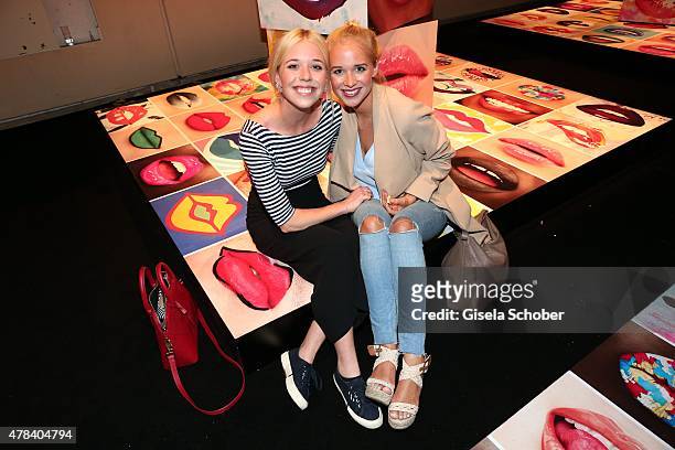 Josefina Vilsmaier and her sister Theresa Vilsmaier during the presentation of 'Art of the Lip' by MAC Cosmetics at Haus der Kunst on June 24, 2015...