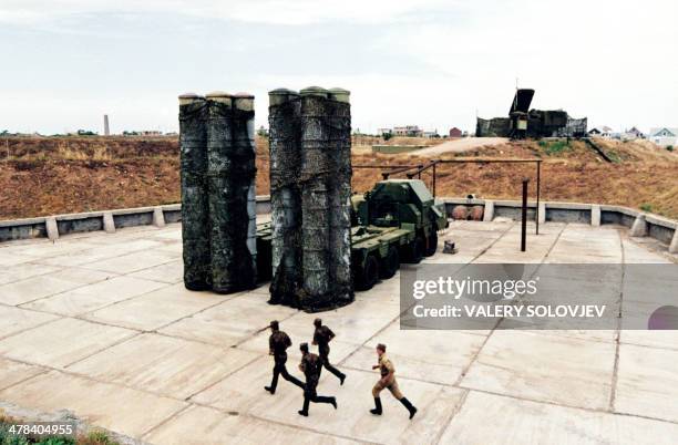 Ukrainian soldiers rush to the Soviet-made S-300 anti-missile station during their training near the large navy base on Black sea, Crimea on July 2...