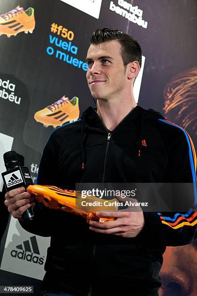 Real Madrid football player Gareth Bale presents the new "adizero f50" Adidas boots at Estadio Santiago Bernabeu on March 13, 2014 in Madrid, Spain.
