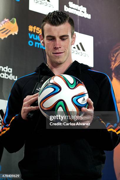 Real Madrid football player Gareth Bale presents the new "adizero f50" Adidas boots at Estadio Santiago Bernabeu on March 13, 2014 in Madrid, Spain.