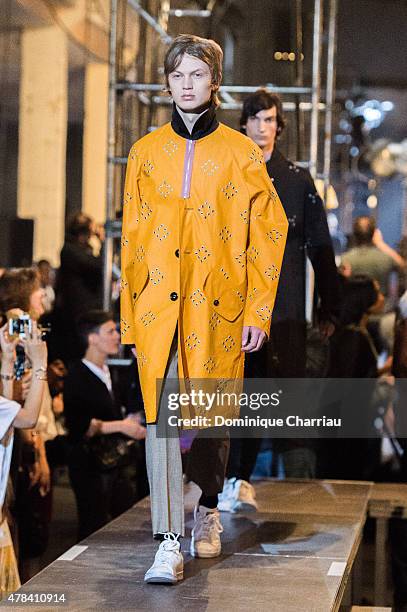 Model walks the runway during the Raf Simons Menswear Spring/Summer 2016 show as part of Paris Fashion Week on June 24, 2015 in Paris, France.