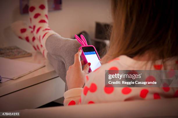 student connecting with technology - child on phone stock pictures, royalty-free photos & images