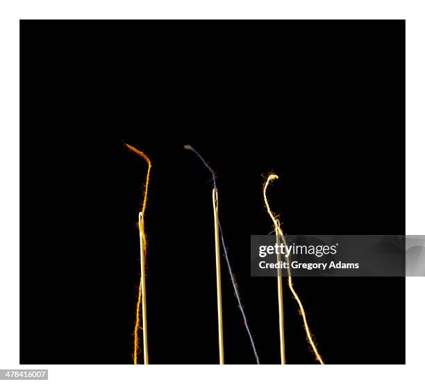 threaded needles on a black background - hatboro imagens e fotografias de stock