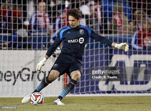 Troy Perkins of Montreal Impact kicks the ball back in play against the FC Dallas at Toyota Stadium on March 8, 2014 in Frisco, Texas.