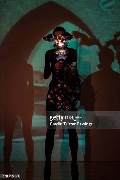 Model stands during the Little Shilpa presentation at the Freemasons Hall during London Fashion Week AW14 at on February 16, 2014 in London, England.