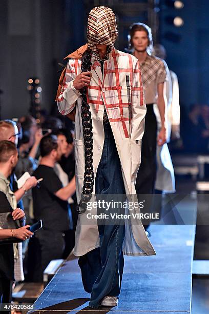 Model walks the runway during the Raf Simons Ready to Wear Menswear Spring/Summer 2016 show as part of Paris Fashion Week on June 24, 2015 in Paris,...