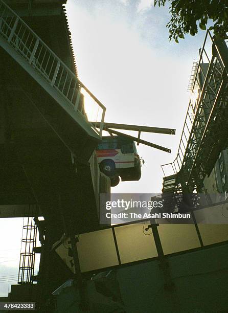 Bus manages to stay on the evelated Hanshin Expressway a after the Great Hanshin earthquake on January 17, 1995 in Nishinomiya, Hyogo, Japan....