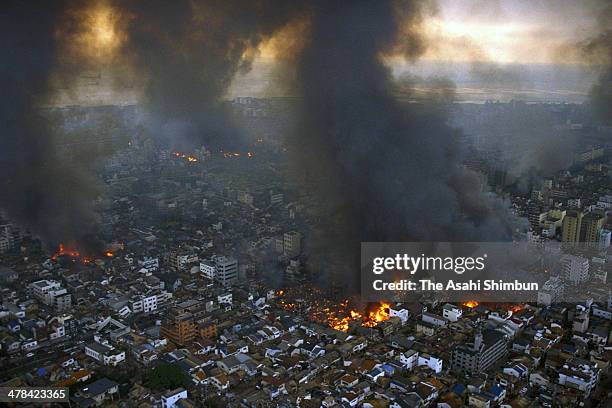 In this aerial image, Kobe city is in blaze after the strong earthquake on January 17, 1995 in Kobe, Hyogo, Japan. Magnitude 7.3 strong earthquake...