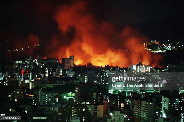In this aerial image, Kobe city is in blaze after the strong earthquake on January 17, 1995 in Kobe, Hyogo, Japan. Magnitude 7.3 strong earthquake...