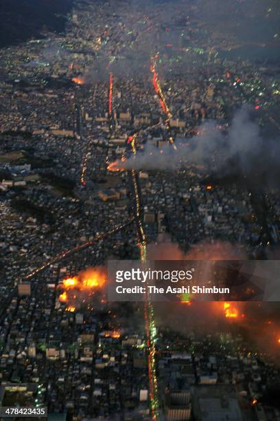 In this aerial image, Kobe city is in blaze after the strong earthquake on January 17, 1995 in Kobe, Hyogo, Japan. Magnitude 7.3 strong earthquake...