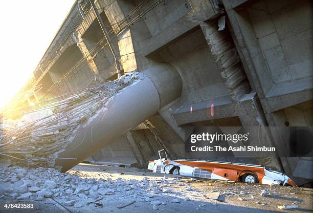 Bus is squashed as the Hanshin Expressway elevated highway collapses after the strong earthquak on Janaury 17, 1995 in Kobe, Hyogo, Japan. Magnitude...