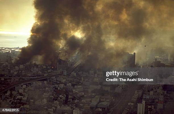 In this aerial image, Kobe city is in blaze after the strong earthquake on January 17, 1995 in Kobe, Hyogo, Japan. Magnitude 7.3 strong earthquake...