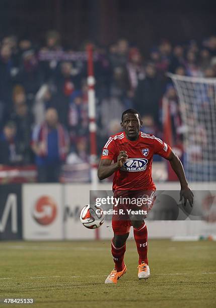 Hendry Thomas of FC Dallas dribbles the ball down field against the Montreal Impact at Toyota Stadium on March 8, 2014 in Frisco, Texas.