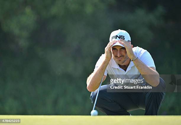Alejandro Canizares of Spain lines up a putt during the first round of the Trophee du Hassan II Golf at Golf du Palais Royal on March 13, 2014 in...