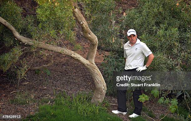 Paul McGinley of Ireland ponders a shot during the first round of the Trophee du Hassan II Golf at Golf du Palais Royal on March 13, 2014 in Agadir,...