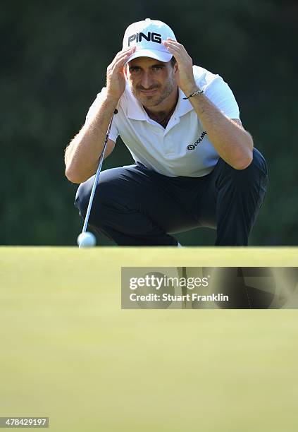 Alejandro Canizares of Spain lines up a putt during the first round of the Trophee du Hassan II Golf at Golf du Palais Royal on March 13, 2014 in...