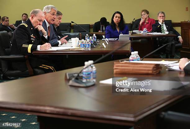 Defense Secretary Chuck Hagel , spseaks as Chairman of the Joint Chiefs of Staff Gen. Martin Dempsey and Defense Undersecretary/Comptroller Robert...