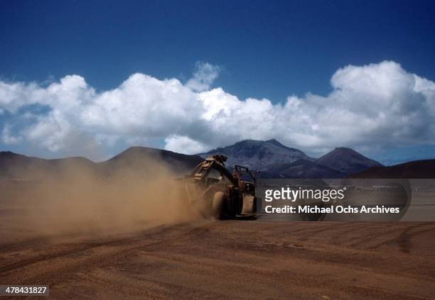 View of a tractor clearing the soil on the US Air Force base on Ascension Island a British Overseas Territory. A joint US Air Force base and Royal...