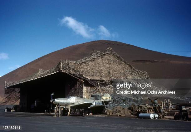 Plane is parked by a hut at the US Army Air Force base on Ascension Island a British Overseas Territory. A joint US Air Force base and Royal Air...