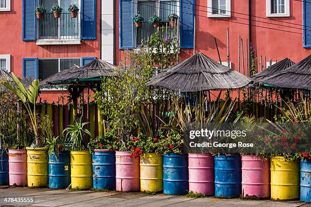 Colorfully painted oil drums highlight an Ocean Beach Avenue restaurant on March 3 in Santa Monica Beach, California. Millions of tourists flock to...