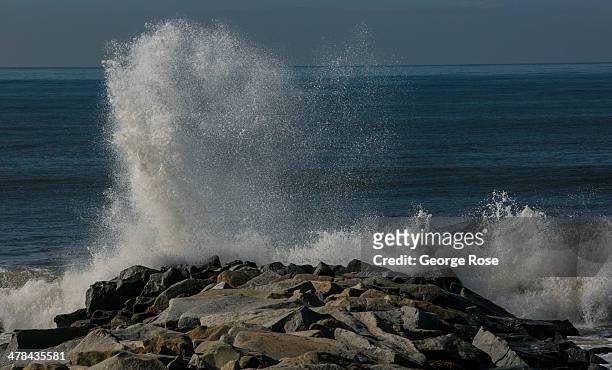 Large ocean waves batter a jetty at Will Rogers State Beach on March 3 in Santa Monica Beach, California. Millions of tourists flock to the Los...
