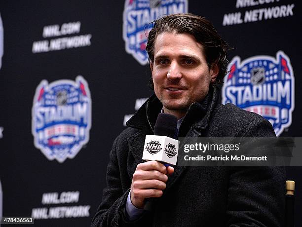 Patrick Sharp of the Chicago Blackhawks talks with the media after a 5-1 win over the Pittsburgh Penguins during the 2014 NHL Stadium Series game on...