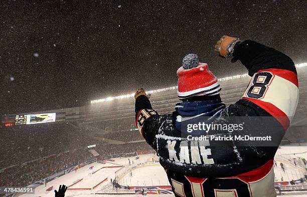 Chicago Blackhawks fans cheers on during the 2014 NHL Stadium Series game against the Pittsburgh Penguins on March 1, 2014 at Soldier Field in...