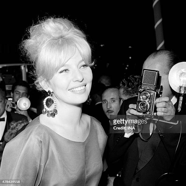 Annette Vadim under the flashes of the photographers during the evening of opening of the Cannes film festival.