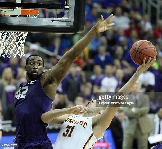 Kansas State forward Thomas Gipson tries to block a shot by Iowa State forward Georges Niang in the closing minutes Thursday, March 13 as K-State...