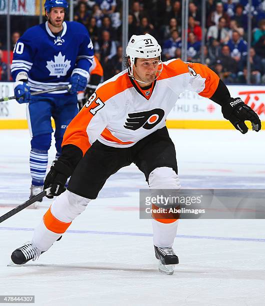 Jay Rosehill of the Philadelphia Flyers skates up the ice during NHL action against the Toronto Maple Leafs at the Air Canada Centre March 8, 2014 in...