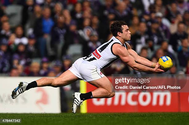 Jarryd Blair of the Collingwood Magpies dives for a mark during the 2015 AFL round thirteen match between the Fremantle Dockers and the Collingwood...