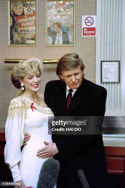 Billionaire Donald Trump touches on April 7, 1993 Marla Maples' stomach to confirm published reports that the actress is pregnant with his child. The...