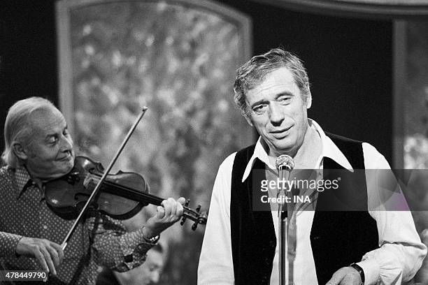 Yves Montand sings accompanied by Stephane Grappelli in the program ""Bench""