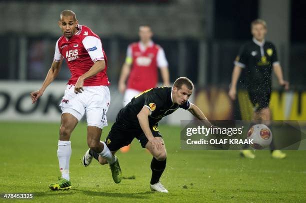 Dutch football cluyb AZ Alkmaar player Simon Poulsen in action with FC Anzhi Makhachkala player Oleksandr Aliyev during the UEFA Europa League...