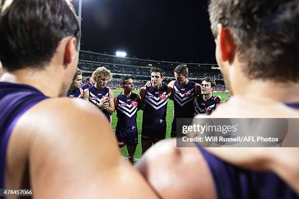 Matthew Pavlich of the Dockers speaks to the huddle at the start of the game during the round 13 AFL match between the Fremantle Dockers and the...