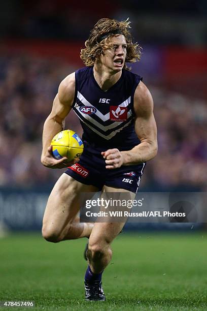 Nathan Fyfe of the Dockers looks to pass the ball during the round 13 AFL match between the Fremantle Dockers and the Collingwood Magpies at Domain...