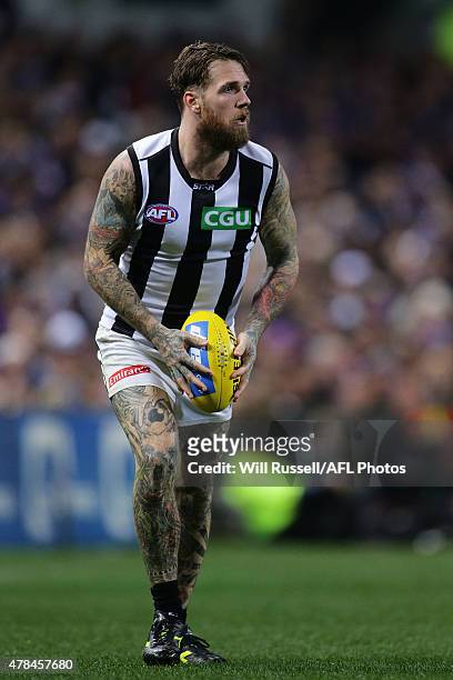 Dane Swan of the Magpies looks to pass the ball during the round 13 AFL match between the Fremantle Dockers and the Collingwood Magpies at Domain...