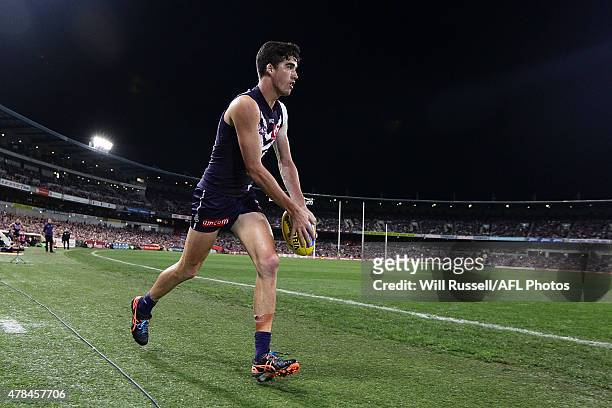 Alex Pearce of the Dockers looks to kick the ball during the round 13 AFL match between the Fremantle Dockers and the Collingwood Magpies at Domain...