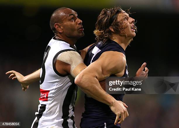 Travis Varcoe of the Magpies and Nathan Fyfe of the Dockers contest for position during the round 13 AFL match between the Fremantle Dockers and the...