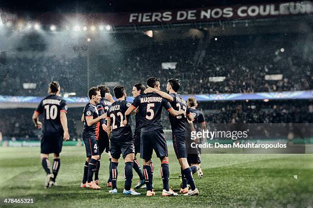 Marquinhos of Paris Saint-Germain celebrates with team mates as he scores their first goal during the UEFA Champions League Round of 16 second leg...