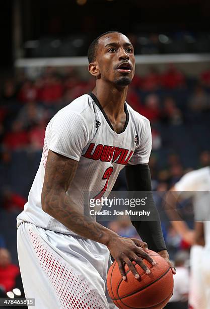 Russ Smith of the Louisville Cardinals shoots a freethrow against the Rutgers Scarlet Knights during the quarterfinal round of the American Athletic...