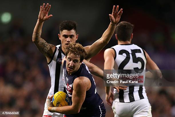 Michael Barlow of the Dockers looks to move the ball on after a mark during the round 13 AFL match between the Fremantle Dockers and the Collingwood...