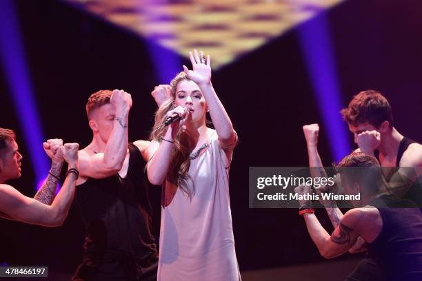 Emmelie de Forest performs during the TV Show 'Eurovision Song Contest - Unser Song fuer Daenemark 2014' at Lanxess Arena on March 13, 2014 in...