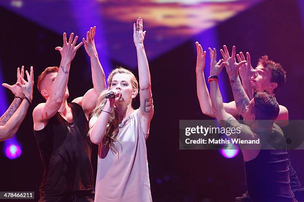 Emmelie de Forest performs during the TV Show 'Eurovision Song Contest - Unser Song fuer Daenemark 2014' at Lanxess Arena on March 13, 2014 in...