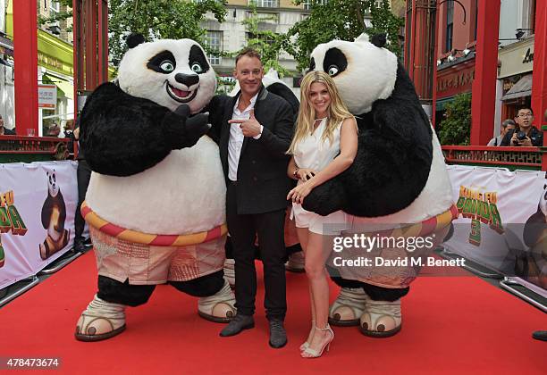 Presenters Toby Anstis and Anna Williamson pose at a photocall for "Kung Fu Panda 3" in Chinatown on June 25, 2015 in London, England.