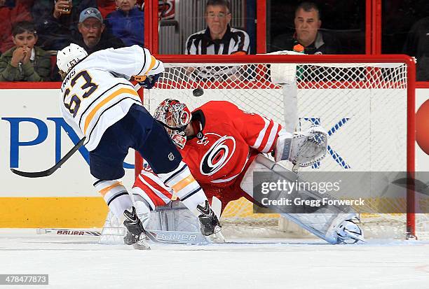 Tyler Ennis of the Buffalo Sabres scores against Cam Ward of the Carolina Hurricanes on a penalty shot during their NHL game at PNC Arena on March...