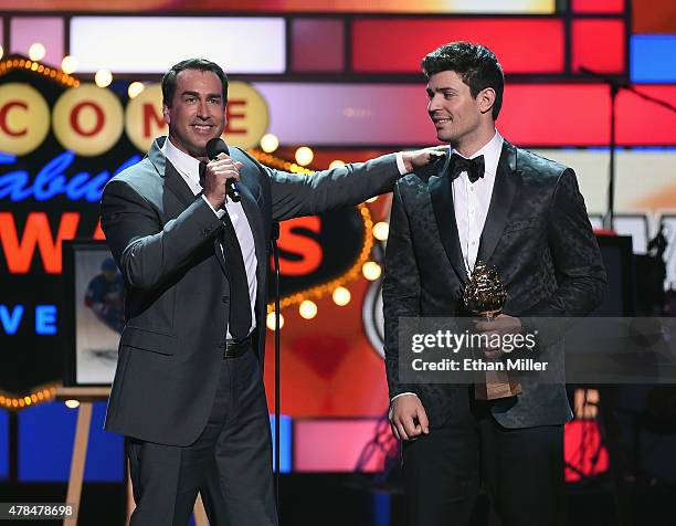 Host Rob Riggle presents the Hart Memorial Trophy to Carey Price of the Montreal Canadiens during the 2015 NHL Awards at MGM Grand Garden Arena on...