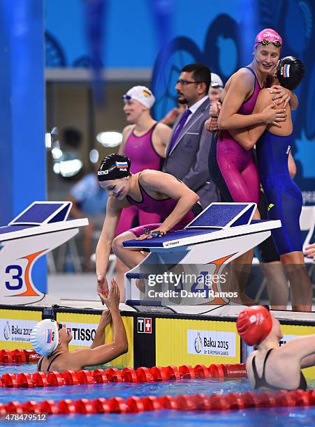 Maria Astashkina, Arina Openysheva, Polina Egorova and Mariia Kameneva of Russia celebrate winning gold in the Women's 4x100m Medley Relay final...